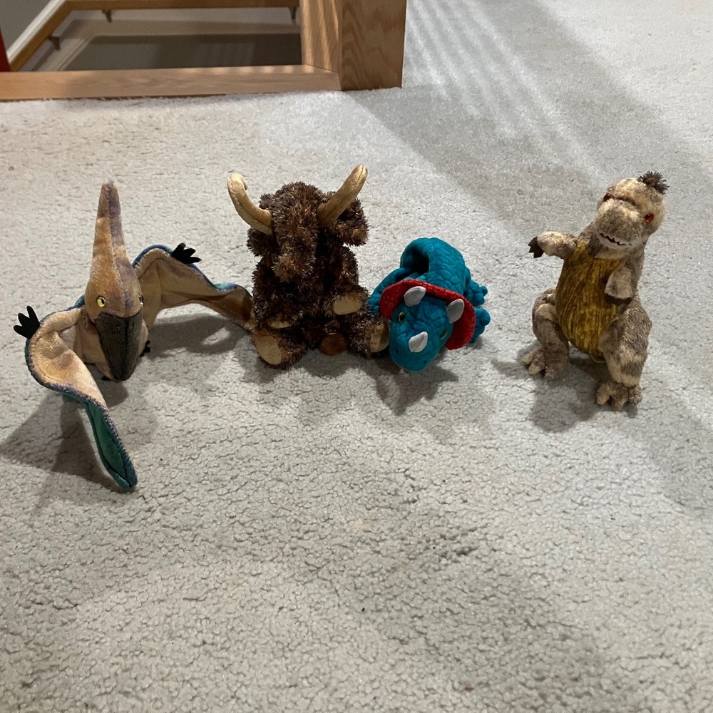 Lot of 4 prehistoric-themed TY Beanie Babies.